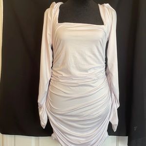 Gorgeous white dress. Has ruching on sides/butt. Gives a great figure. Sz-L